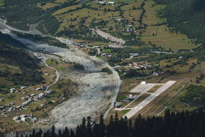 Aerial view of airport runway on landscape