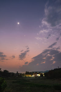 Scenic view of field against sky at night