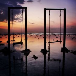 Scenic view of lake against sky at sunset