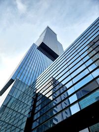 Low angle view of skyscraper against sky