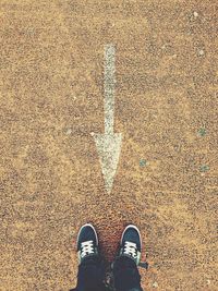 Low section of person standing on ground