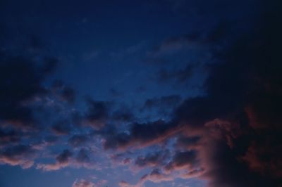 Low angle view of dramatic sky at night