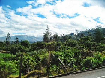 Scenic view of mountains against cloudy sky