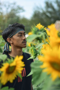 Portrait of young man looking away