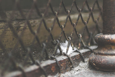 Full frame shot of rusty metal fence during winter