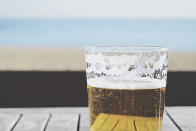 Close-up of beer glass on table