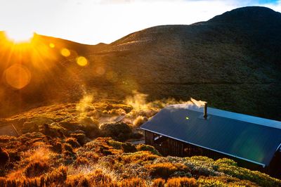 High angle view of house on mountain during sunny day