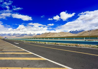 Empty road against sky