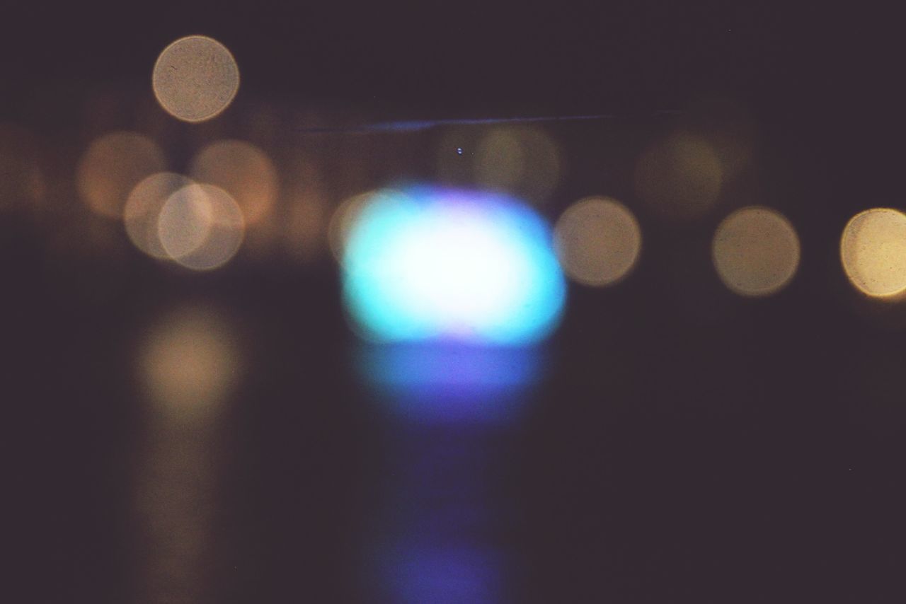 DEFOCUSED IMAGE OF ILLUMINATED LIGHTS