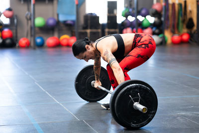 Low section of man exercising in gym