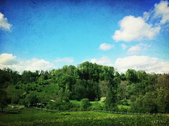 Scenic view of landscape against cloudy sky