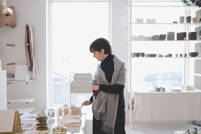 Young female customer examining swatches in store