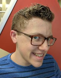 Close-up portrait of smiling young man