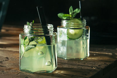 Close-up of drinks in jars on table