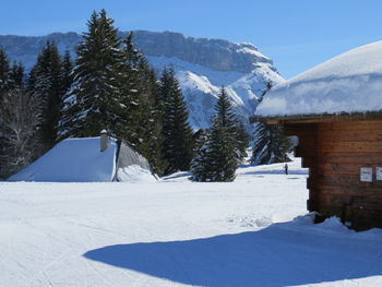 Scenic view of snow covered mountains against sky