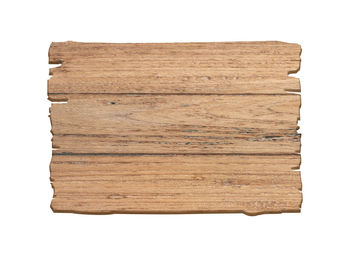 Surface level of wooden plank against white background