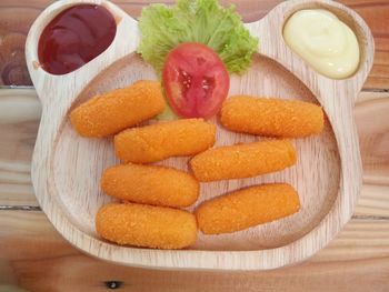 High angle view of fruits in plate on table