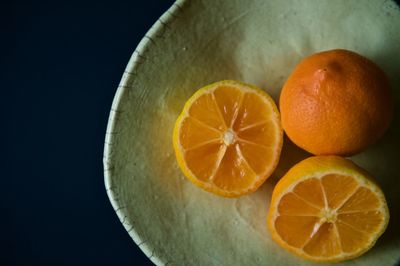 Close-up of oranges against black background