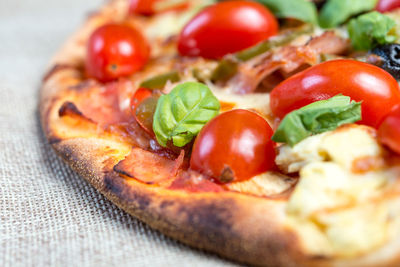 Close-up of pizza on jute
