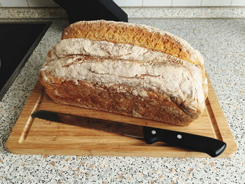 High angle view of bread on cutting board