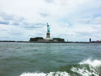 Statue in city at waterfront