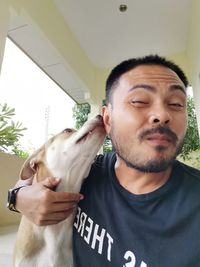 Portrait of man with dog