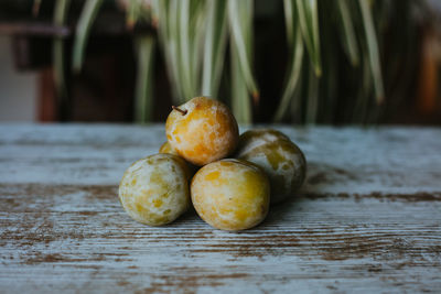 Close-up of plums on table