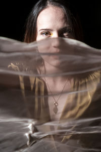 Portrait of young woman in car