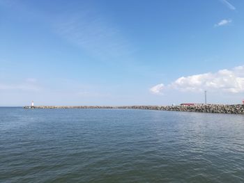 Scenic view of sea against blue sky