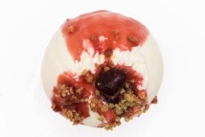 Close-up of strawberry cake against white background