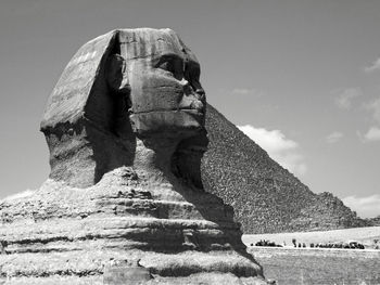 Statue of a woman in a desert