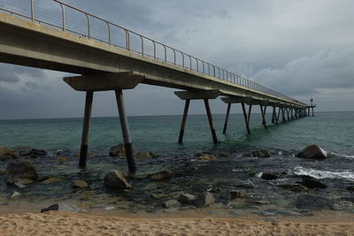 Pier over sea against sky