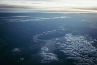 Aerial view of island amidst sea against sky