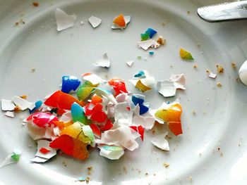 High angle view of multi colored candies in plate