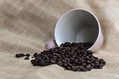 Close-up of coffee beans on table