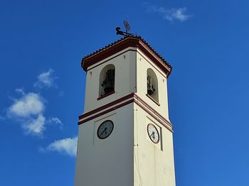 Low angle view of clock tower against sky