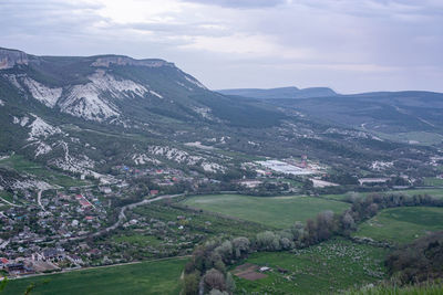 Scenic view of landscape and mountains against sky