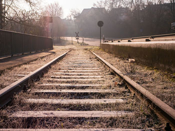 View of railroad tracks in foggy weather