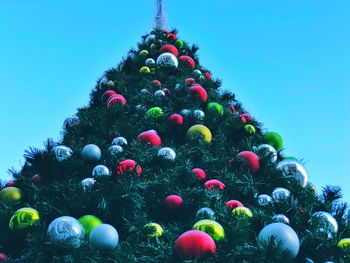 Low angle view of christmas tree against sky