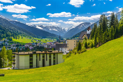 Scenic view of trees and mountains against sky