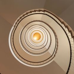 Directly below shot of spiral staircase of building