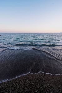 Scenic view of sea against clear sky during sunset