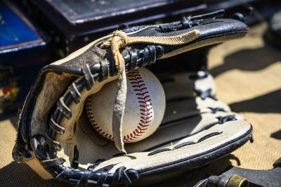 Close-up of baseball glove and ball 