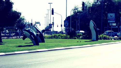 Empty road with buildings in background