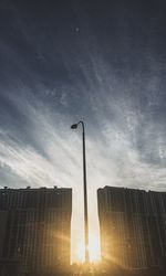 Low angle view of building against sky at sunset