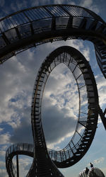 Low angle view of tiger and turtle rollercoaster against sky