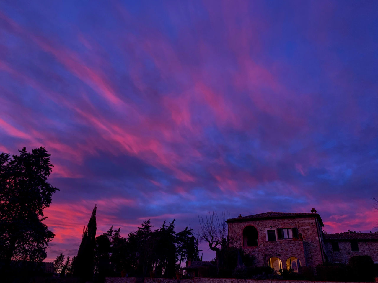 sky, building exterior, architecture, built structure, cloud - sky, sunset, tree, plant, nature, building, silhouette, no people, beauty in nature, low angle view, dramatic sky, house, dusk, outdoors, residential district, scenics - nature