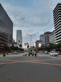 City street and modern buildings against sky