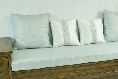High angle view of cushions on sofa at home