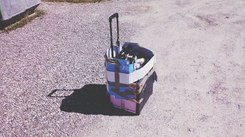 Close-up of dustbin on road